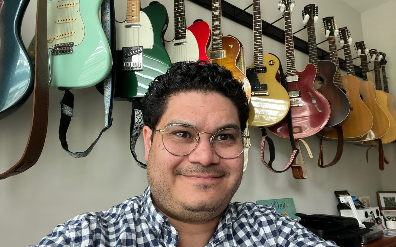 Part of Anthony's guitar collection on the wall
